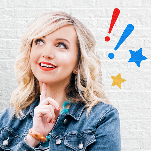 Mindy Thomas wondering with one finger on her chin