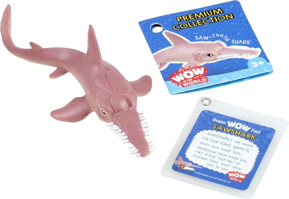 May contain a pink plastic sawshark toy, a product label, and a fact card about sawsharks.